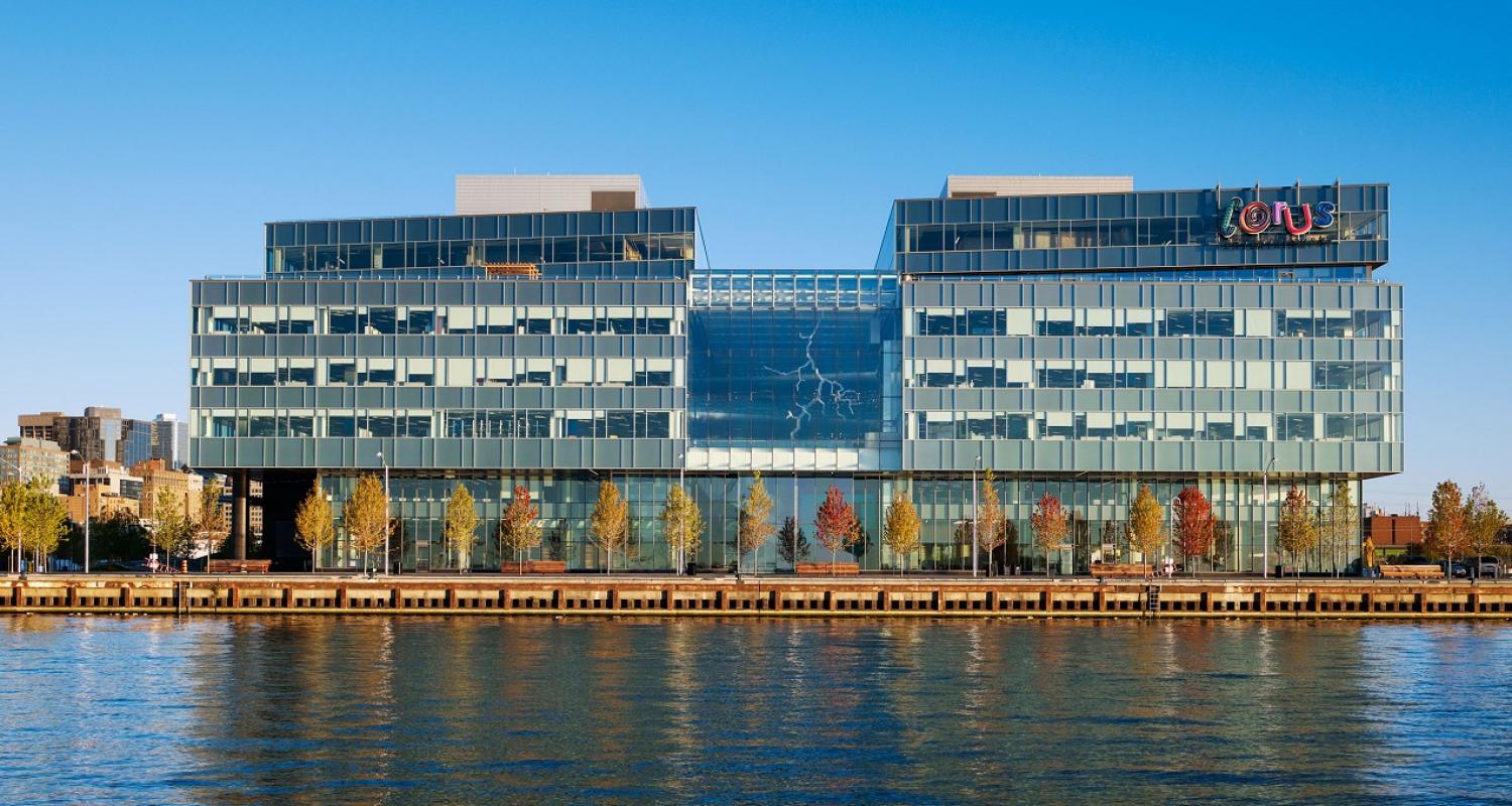 exterior of a commercial building right next to the water's edge