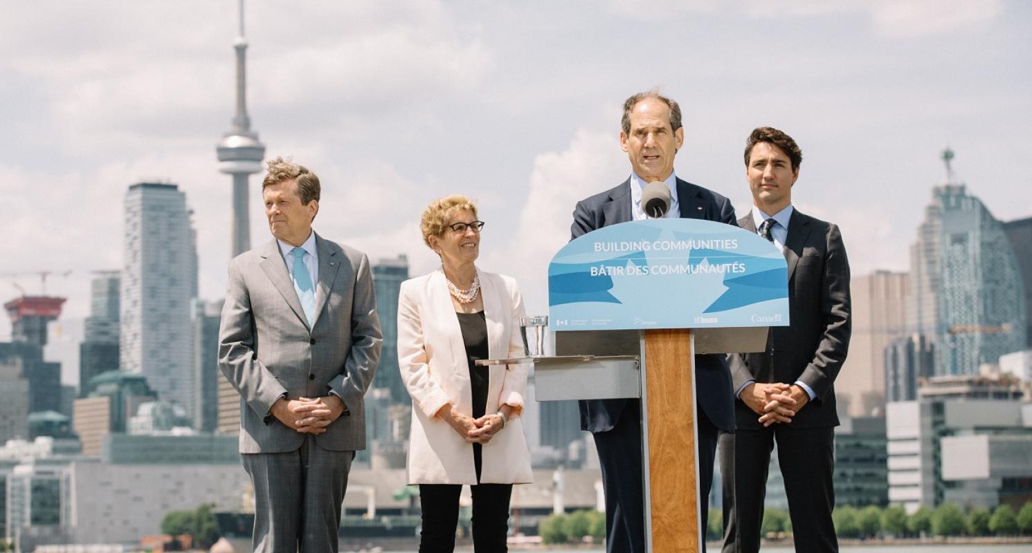 event photo of officials speaking at a podium