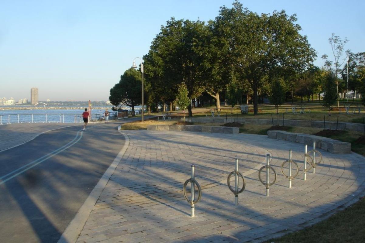 cyclist and pedestrian on a waterfront trail