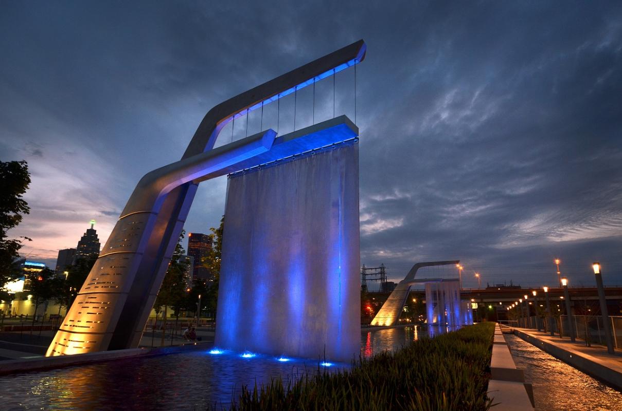 public art water features lit up at night