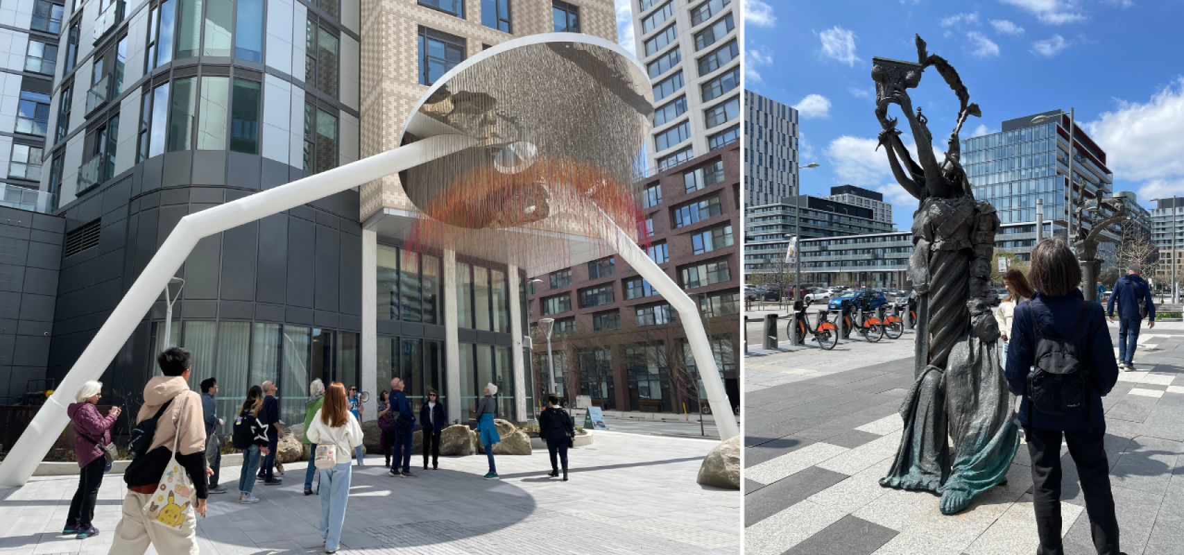 Visitors observing public art, In Equilibrium, with modern buildings in the background, and Garden of Future Follies, with clear sky and buildings in background.