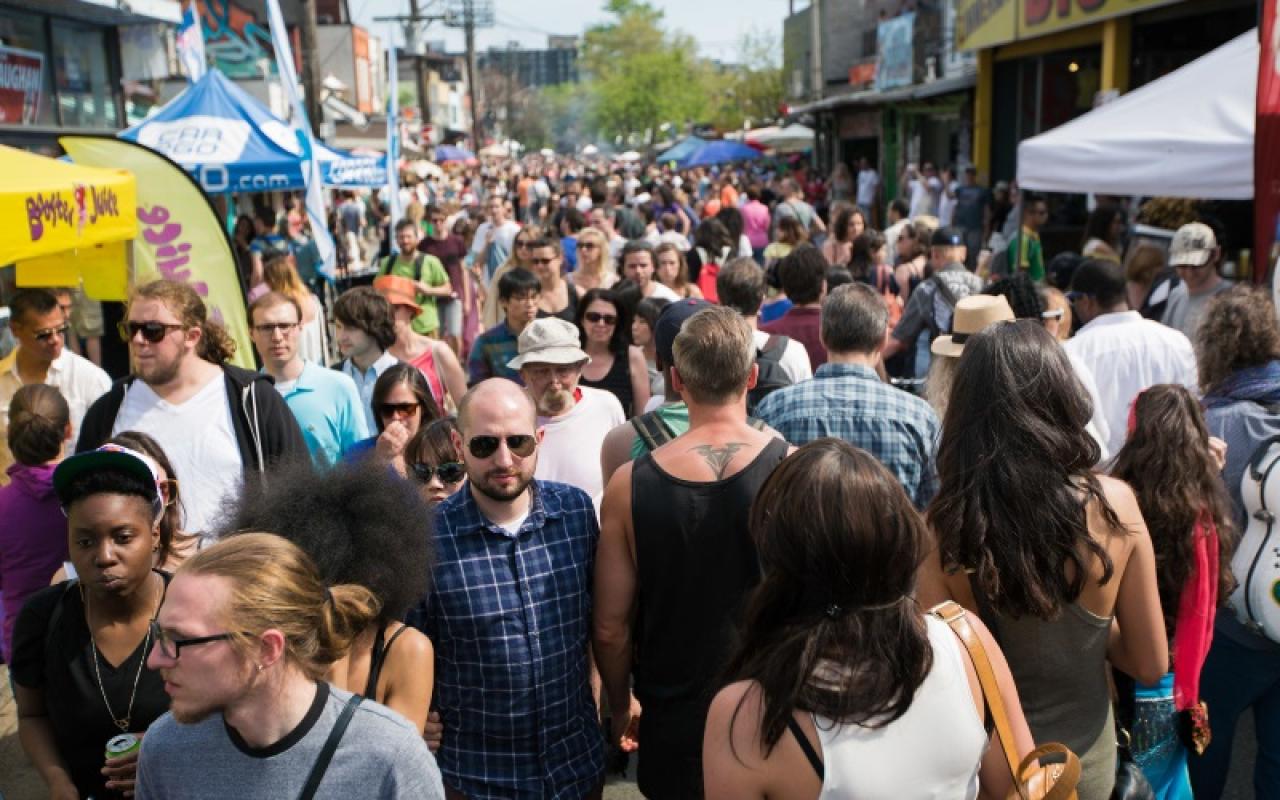 People flood the streets in Toronto’s Kensington Market during a Pedestrian Sunday event.