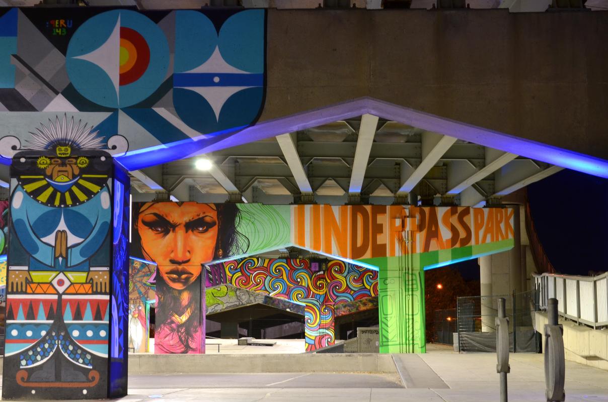 colourful murals painted on concrete pillars at Underpass Park.