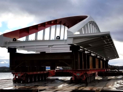 a white and red bridge on a barge