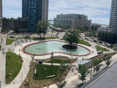 aerial view of an urban park with a large heart shaped pond