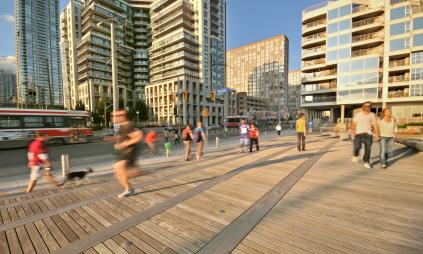 people walking and jogging along the busy waterfront