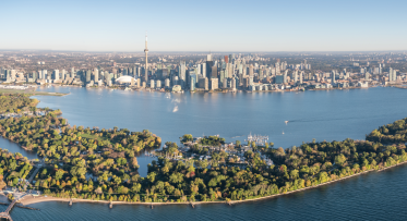 An aerial photo looking north over Toronto Island and Toronto's skyline. 