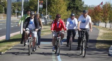 a group of cyclists at an opening celebration