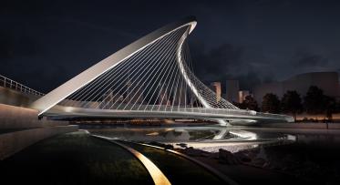 A curvy arched pedestrian bridge shown in a night view rendering.