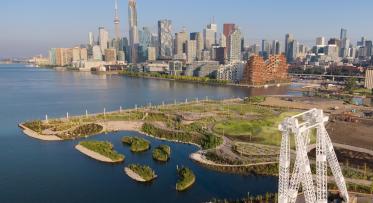Aerial perspective of Toronto's waterfront and skyline from Biidaasige Park