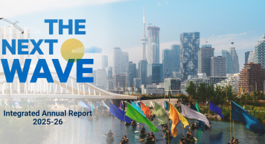 Canoes carrying colourful flags traveling under a bridge with the Toronto Skyline in the back. Text on the image reads 'The Next Wave, Integrated Annual Report 2025-26'