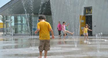 Playing in the water at the Sherbourne Common splash pad